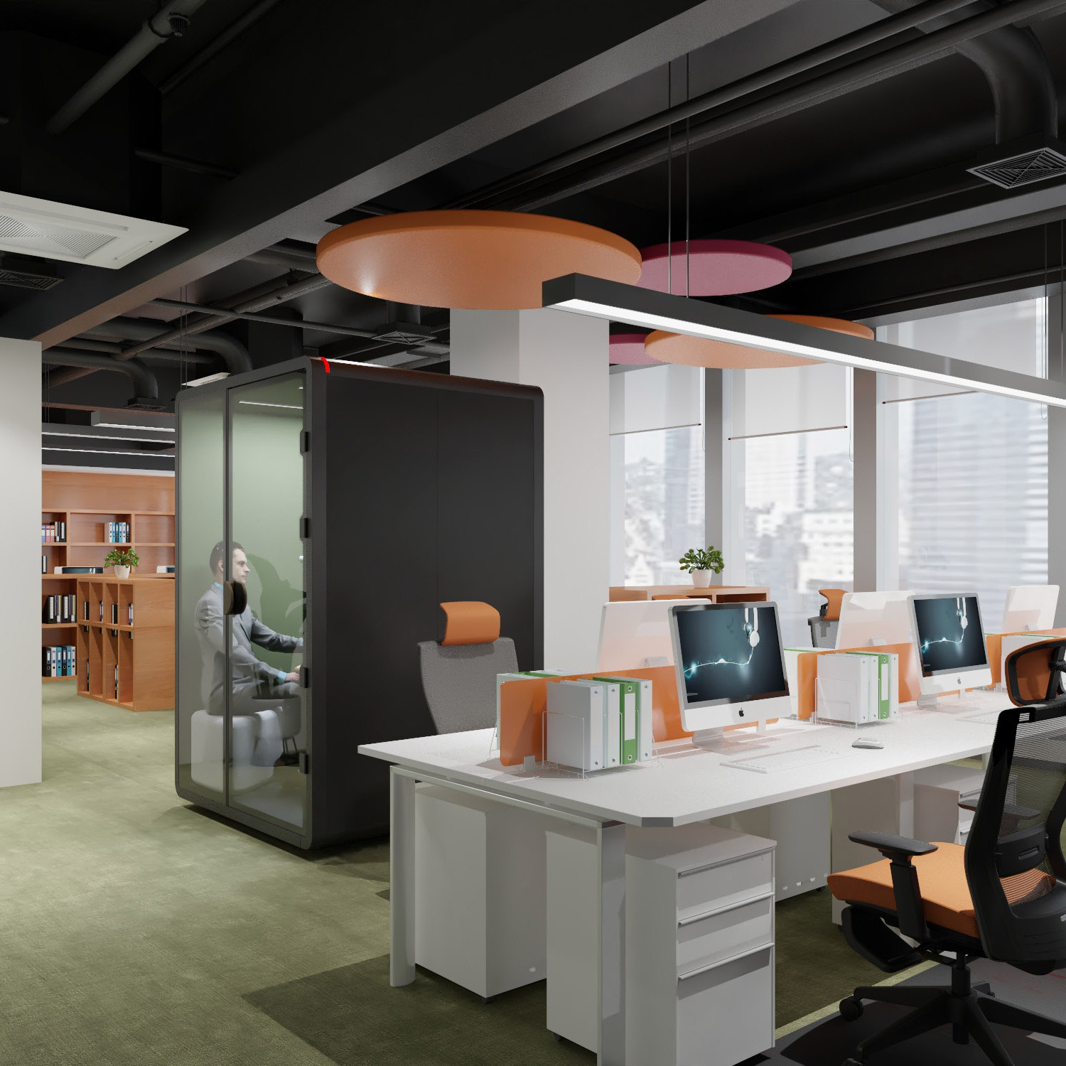 image of a man sitting in an office pod talking on the phone